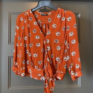 Floral wrap front silk top